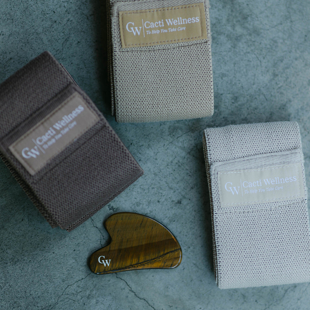 The Sculpt Bundle by Cacti Wellness including the Tiger's Eye Gua Sha and 3-Pack of Neutral Resistance Bands