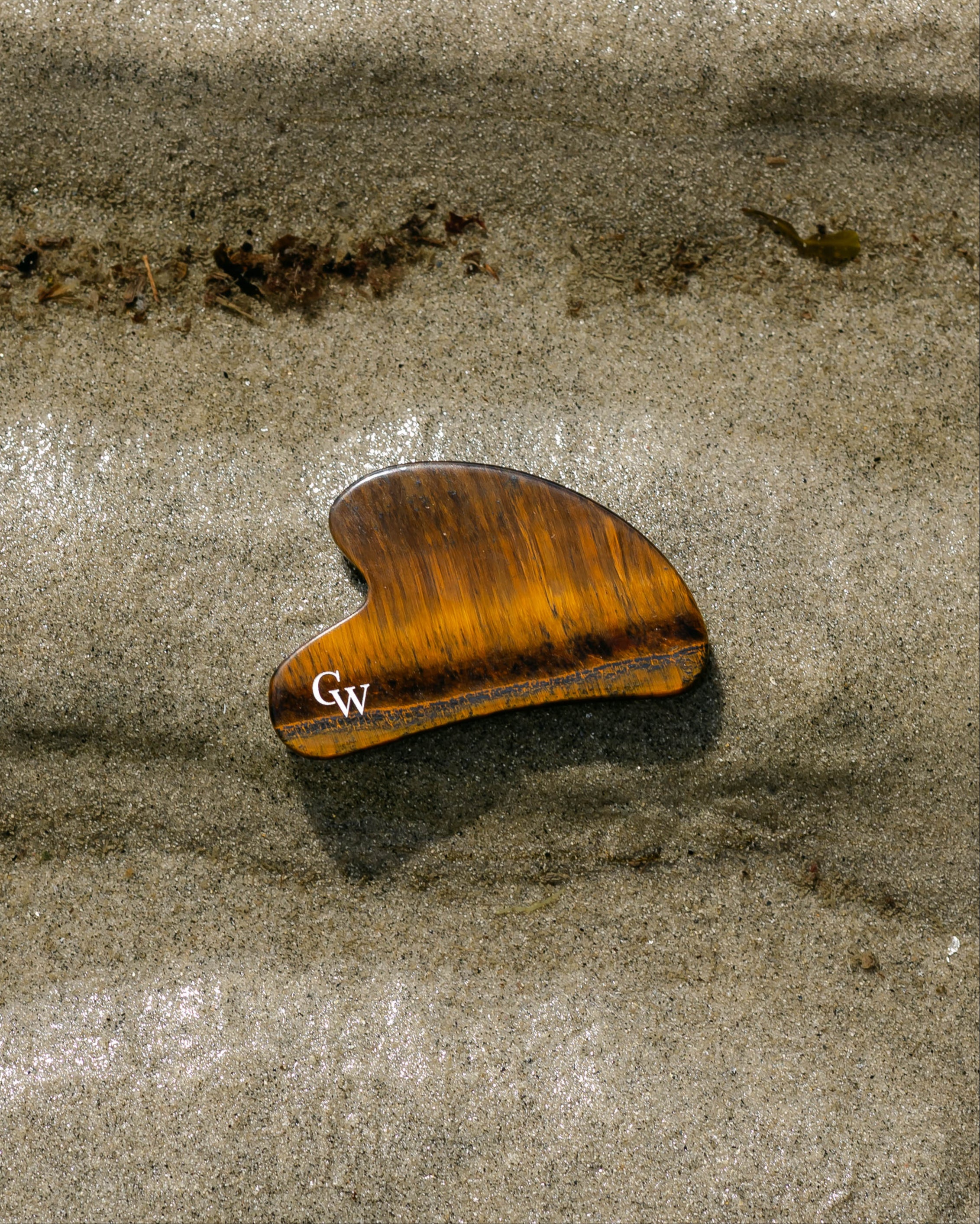 Tiger’s Eye gua sha facial massage tool for sculpting and skincare